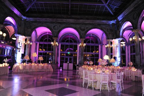 Purple uplighting in an arched venue